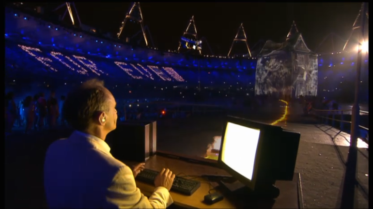 Sir Tim Berners-Lee live-messages at 2012 Olympics opening ceremony with a NeXT Cube by his side - enlarge